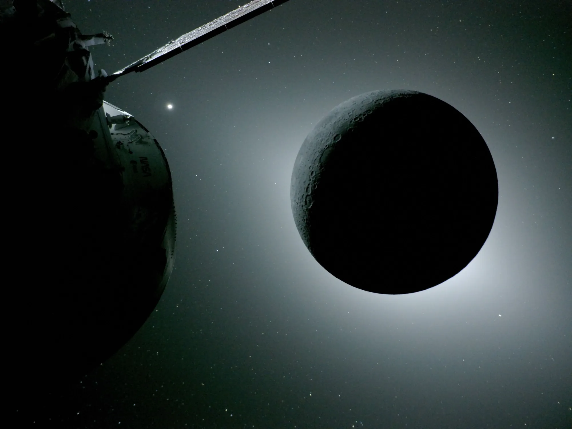 A dark Moon ringed by a faint glow, with Orion's solar array wing and stars around it